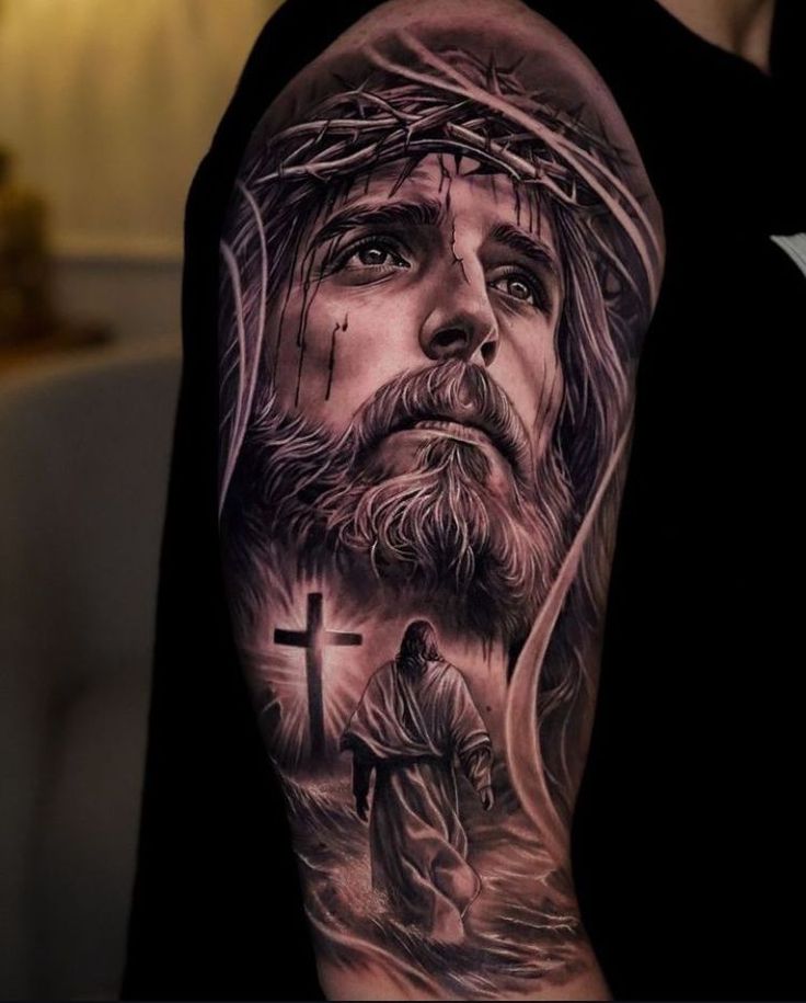 a man with a cross and jesus on his shoulder is shown in this tattoo design