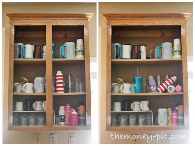 two wooden shelves filled with cups and mugs