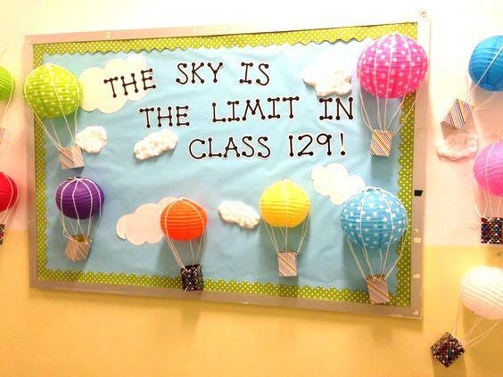 the sky is the limit in class bulletin board with hot air balloons attached to it