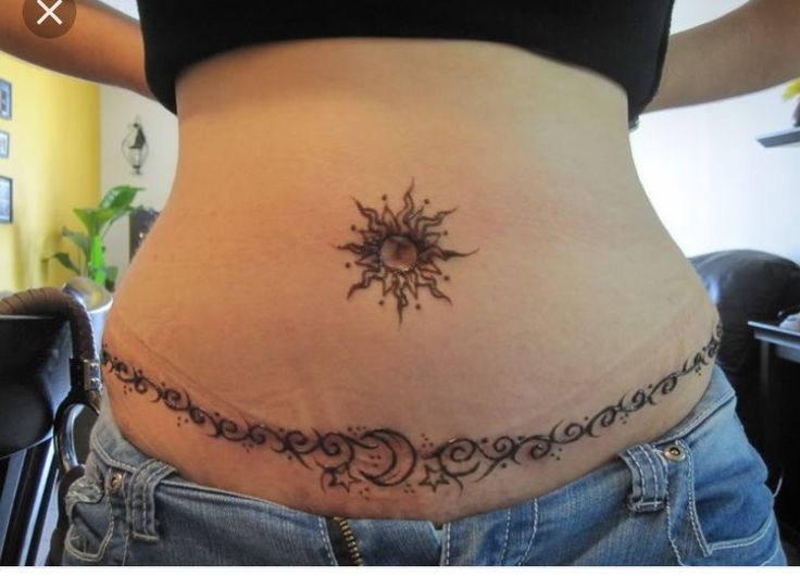 a woman with a tattoo on her stomach