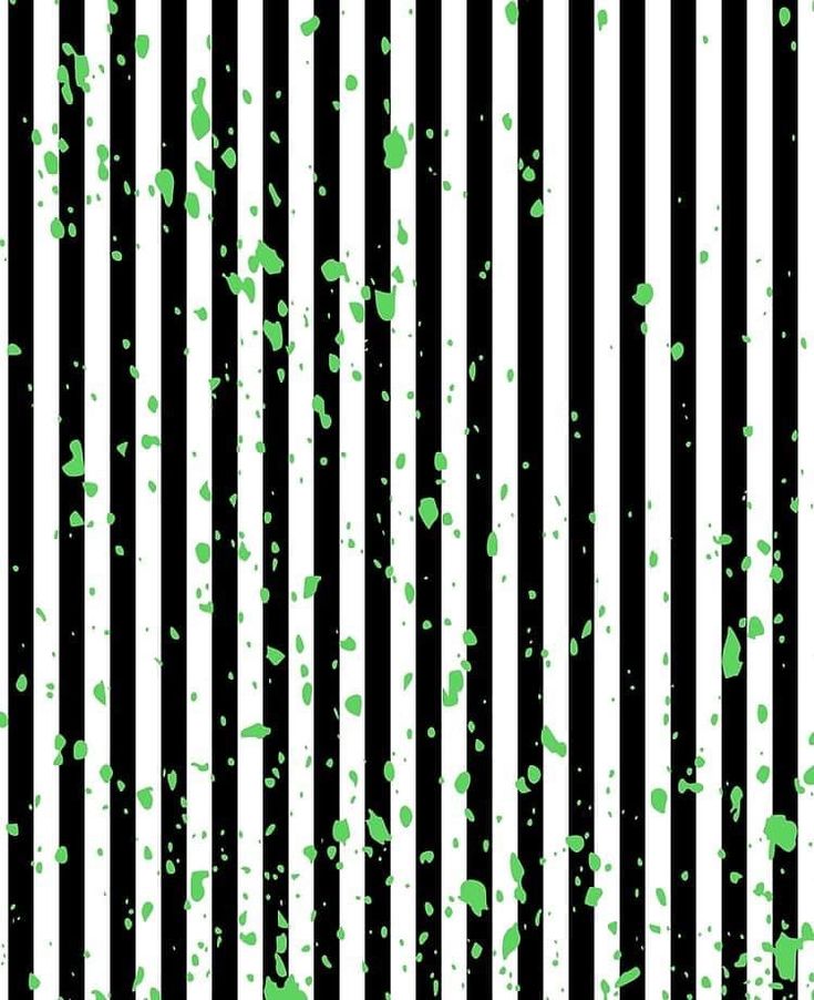 green and white paint splattered on black and white striped background with vertical stripes