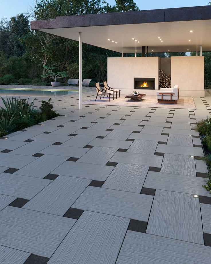 an outdoor living area with fireplace and patio furniture