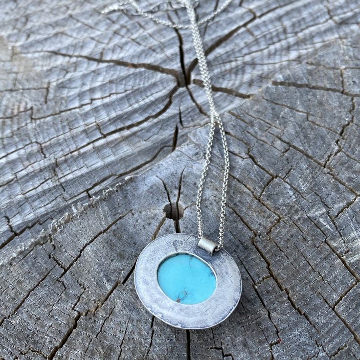 " A go-to, everyday wear pendant necklace! Sky blue Sierra Nevada Turquoise is set in fine and sterling silver, a double-freeform oval with an open backing. Great on its own or layering! Oxidized and tumbled for a satin finish. Pendant measures approximately 22mm tall by 26mm wide. ___" sterling silver rolo chain with a sterling lobster clasp. Artisan Turquoise Oval Necklace, Artisan Turquoise Necklace With Oval Pendant, Artisan Turquoise Oval Pendant Jewelry, Artisan Oval Turquoise Blue Necklace, Turquoise Necklace With Large Oval Stone, Turquoise Necklace With Large Oval Pendant, Artisan Blue Oval Turquoise Necklace, Turquoise Necklace With Large Oval Stone Pendant, Handmade Turquoise Necklace With Oval Pendant