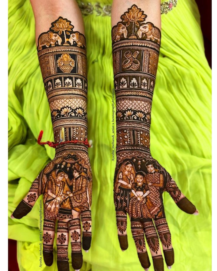 two hands with henna designs on them