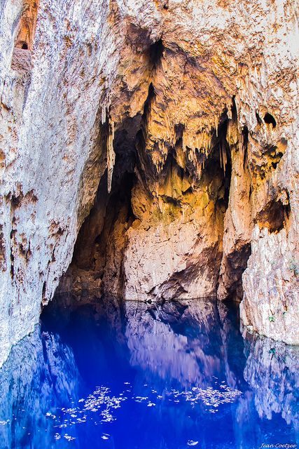 the water is blue and clear in this cave