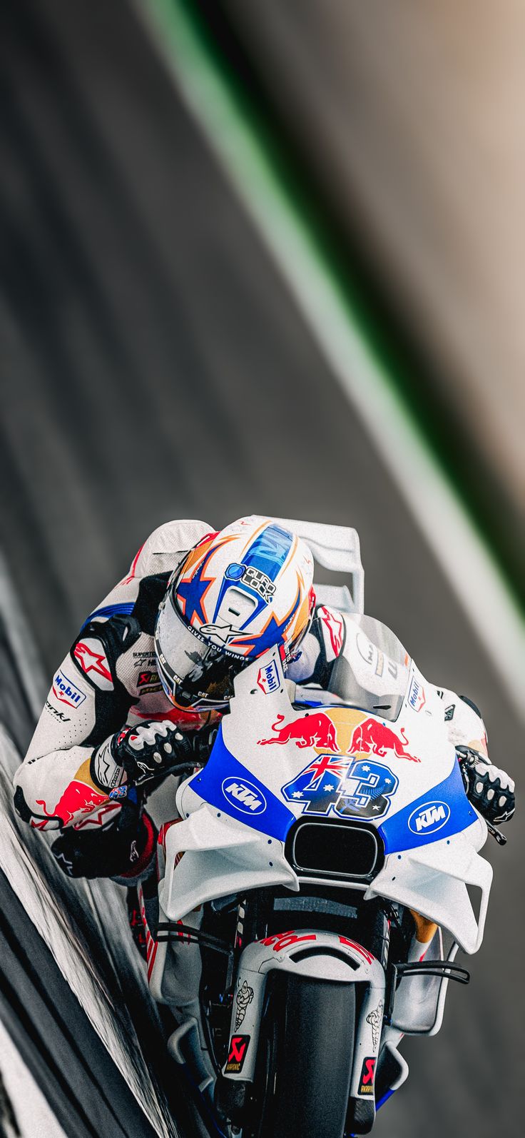 a person riding a motorcycle on a race track