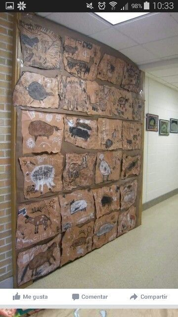 the wall is made out of cardboard and has pictures on it