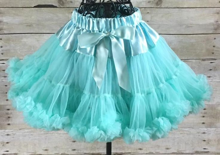 Mint Green Pettiskirt accented with a Mint Green Satin Bow Your adorable lil' princess will turn heads with our beautiful soft, extra fluffy Mint Green Pettiskirt. Perfect for photo shoots, birthday parties and a girl party favor, special occasions like, Flower Girl, a Parade, Dance Recital or just playing dress-up. Our Mint Green Pettiskirt is made with the highest quality nylon/chiffon and a soft satin elastic expandable waistband and bow and has 2 full layers of ruffles and a liner, so your l Photo Shoots Birthday, Mint Outfit, Mint Skirt, Girls Dancewear, Girls Party Favors, Fluffy Skirt, Handmade Skirts, Pastel Mint, Dance Recital