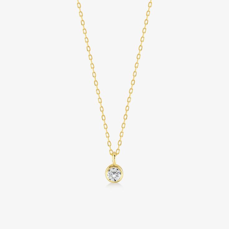 DETAILS * We never use gold plates or gold-filled metals in any of our jewelry. All the metals we use are lead-free, nickel-free, and hypoallergenic. * 0.06 ct Solitaire Pendant Width: 3 mm * 0.06 ct Solitaire Pendant Height: 3 mm * Chain Length: 18 inches * Chain Type: Dainty Cable * Clasp: Spring Ring * Ready to Ship in 1-3 Business Days * 100% US sourced * 6 Months Warranty * Free returns within 30 days from the order date DIAMOND DETAILS * Gem Stone: Genuine Diamond * Diamond-Cut: Round * Diamond Carat Weight: 0.03CT - 0.06 CT - 0.15 CT * Diamond Color-Clarity: H Color, SI Clarity * Setting Type: Bezel Setting * 100% US sourced HANDMADE * Handcrafted by our trusted craftsmen with care. * 100% Ethically Sourced. * All processing of the packaging is done by hand.  * The Preparation packa Dainty Diamond Necklace, Solitaire Necklace, Diamond Solitaire Necklace, Gold Diamond Necklace, Solitaire Necklaces, Bezel Set Diamond, Solitaire Pendant, Bezel Diamond, Diamond Fashion