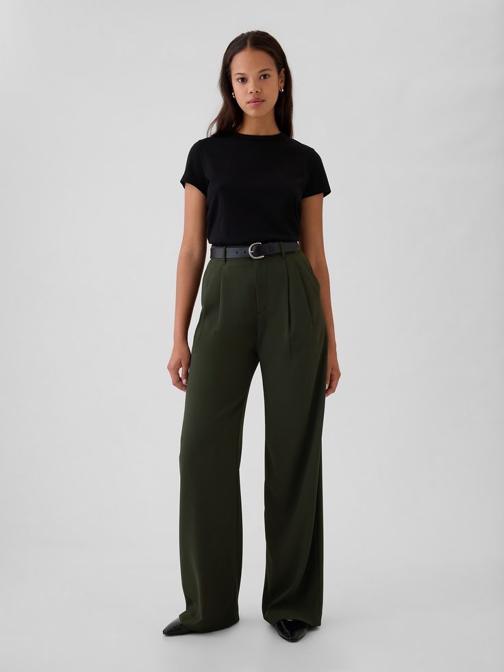 Soft woven trousers.  E-waist with concealed hook and bar closure, zip fly.  Front slant pockets, back welt pockets.  Pleating at front.  * Fit: Classic.  An easy silhouette that fits close  at the waist, and is relaxed through the hips and thigh.  Models wearing Gap Green Business Pants, Hip Business Casual, Business Casual For Nurses, Styling Green Trousers, Massage Therapist Outfits For Women, Women’s Work Wear, Transmasc Formal Wear, Dark Green Pants Outfit Work, Women’s Slacks