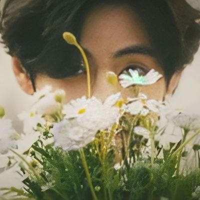 a close up of a person's face with flowers in the foreground