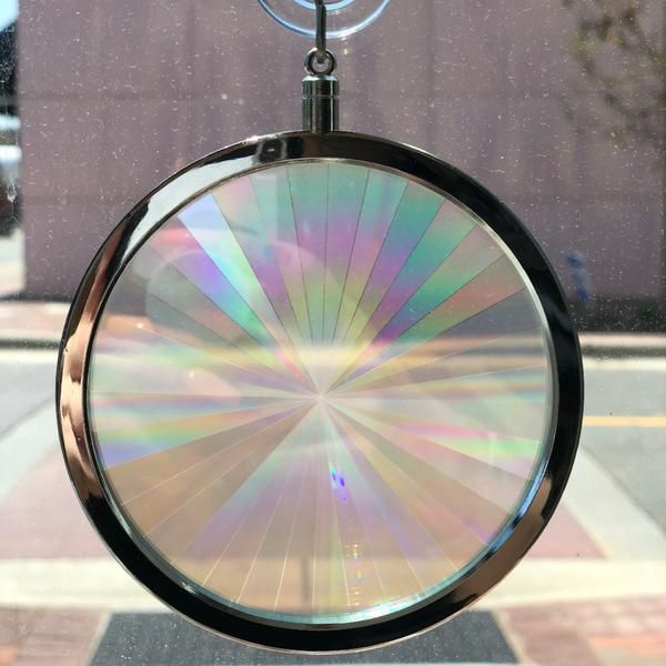 a circular object hanging from the side of a window