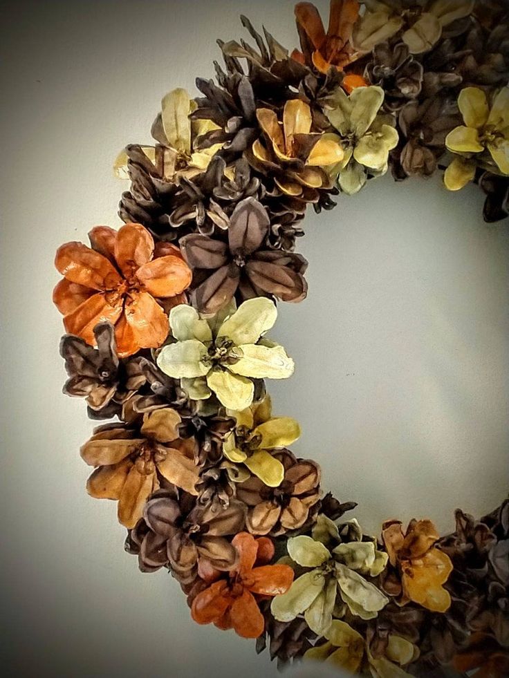 a close up of a wreath with flowers on it