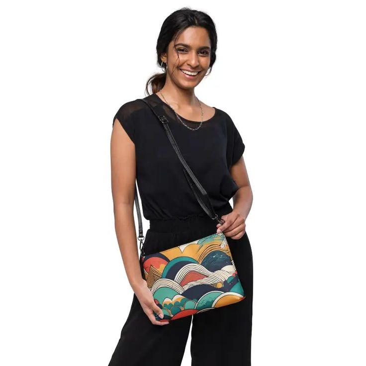 Retro Abstract Crossbody Bag: Stylish & Durable! Elevate your style with our Retro Abstract Crossbody Bag, featuring a vibrant colored abstract pattern that exudes retro charm. Crafted from premium faux leather and lined with 100% polyester, this bag is not only stylish but also built to last. The dark gray hardware adds a touch of sophistication, while the zip-top closure and multiple inside pockets ensure that your essentials stay secure and organized. What makes this crossbody bag truly unique is its versatility. With removable wrist and shoulder straps, you can effortlessly transition from a daytime accessory to a chic evening bag. The adjustable strap drop length of 14"-27" guarantees a comfortable fit for all body types. Measuring 11" x 8" x 1.5", this bag offers the ideal size for y Casual Clutch With Removable Pouch, Casual Clutch With Zipper Pouch, Casual Clutch With Adjustable Strap For Travel, Casual Travel Clutch With Adjustable Strap, Versatile Multicolor Crossbody Shoulder Bag, Versatile Multicolor Bags For On-the-go, Versatile Multicolor Bag For On-the-go, Versatile Multicolor Shoulder Bag For Everyday, Multicolor Clutch With Detachable Strap For Everyday Use