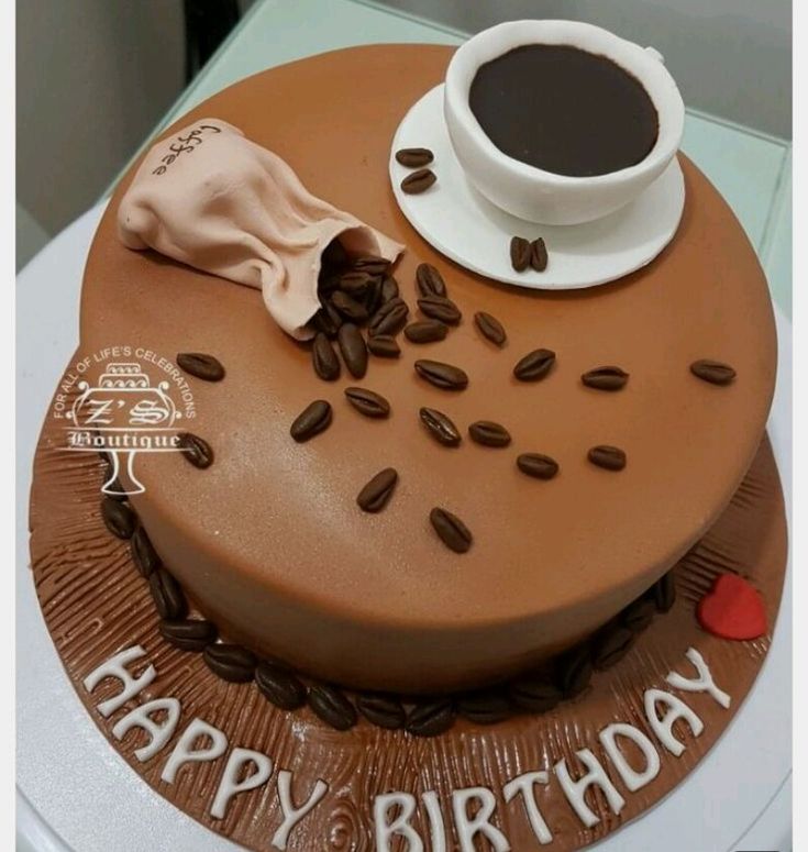 there is a cake with coffee on it and the words happy birthday written in frosting