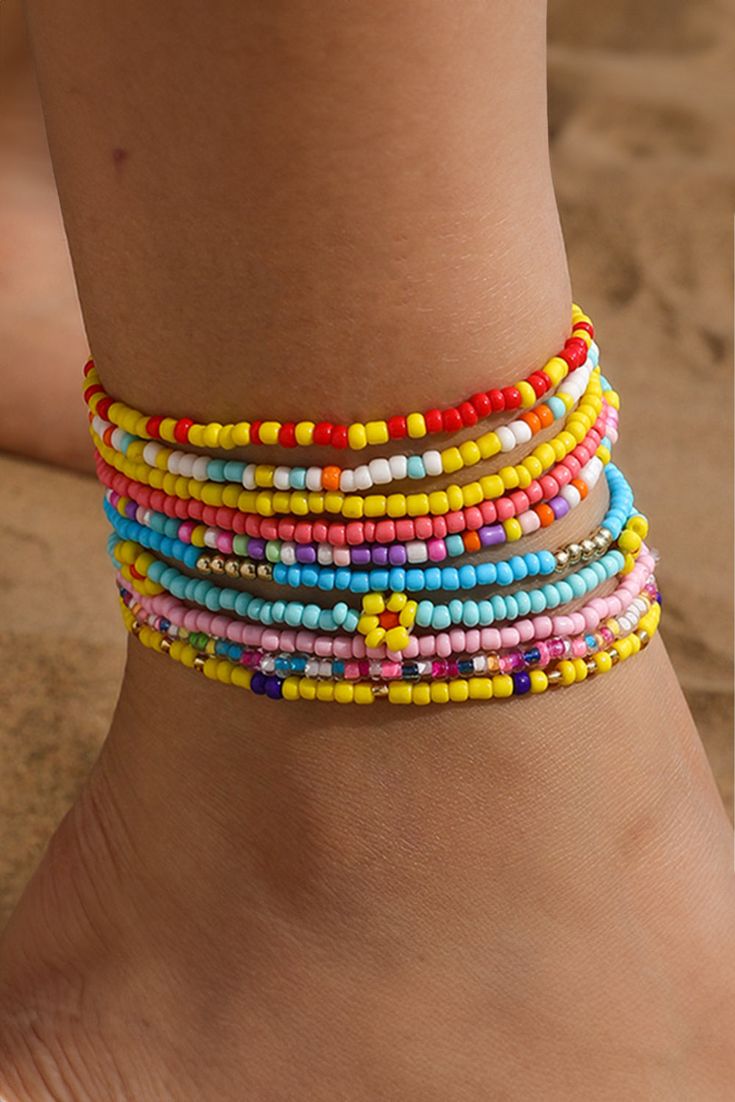 This multi-layered beaded anklet set features a beautiful yellow flower design with random color beads. Each layer adds depth and charm, making it the perfect accessory for any summer outfit. Handcrafted with precision and attention to detail, this anklet set is sure to make a statement. Beaded Anklet, Ankle Jewelry, Tiny Beads, Bohemian Aesthetic, Bright Eye, Color Beads, Plastic Crafts, Next Fashion, Layered Design