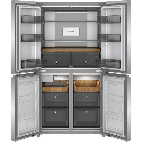 an open refrigerator freezer with its doors wide open and the bottom section showing it's drawers