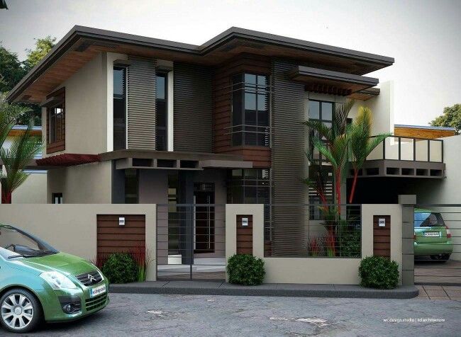 a green car parked in front of a two story house