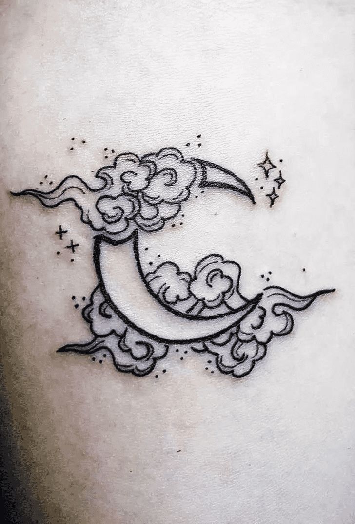 a black and white photo of a crescent moon tattoo