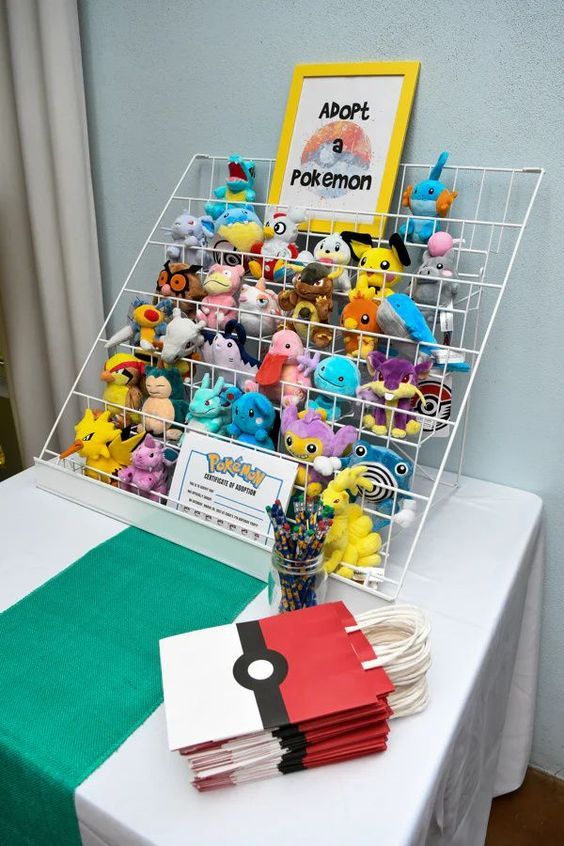 a table topped with lots of stuffed animals