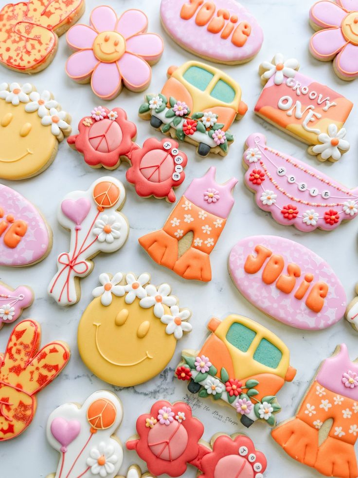 some decorated cookies are laying on a table