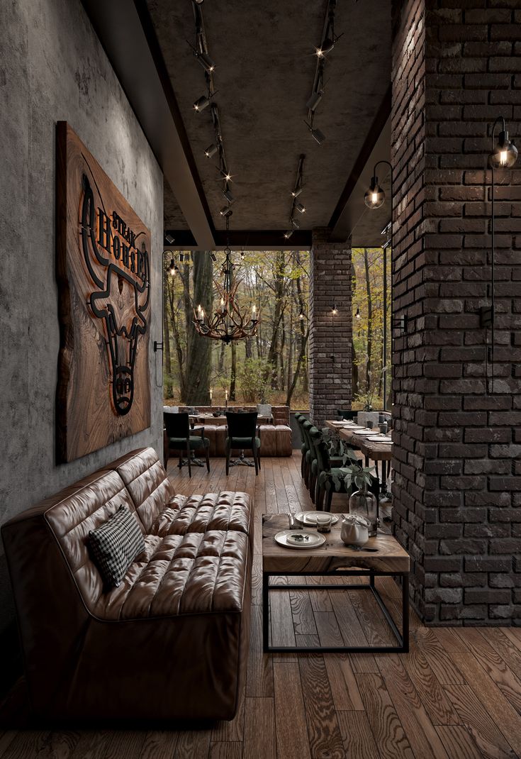 a living room filled with furniture next to a brick wall and wooden floored walls