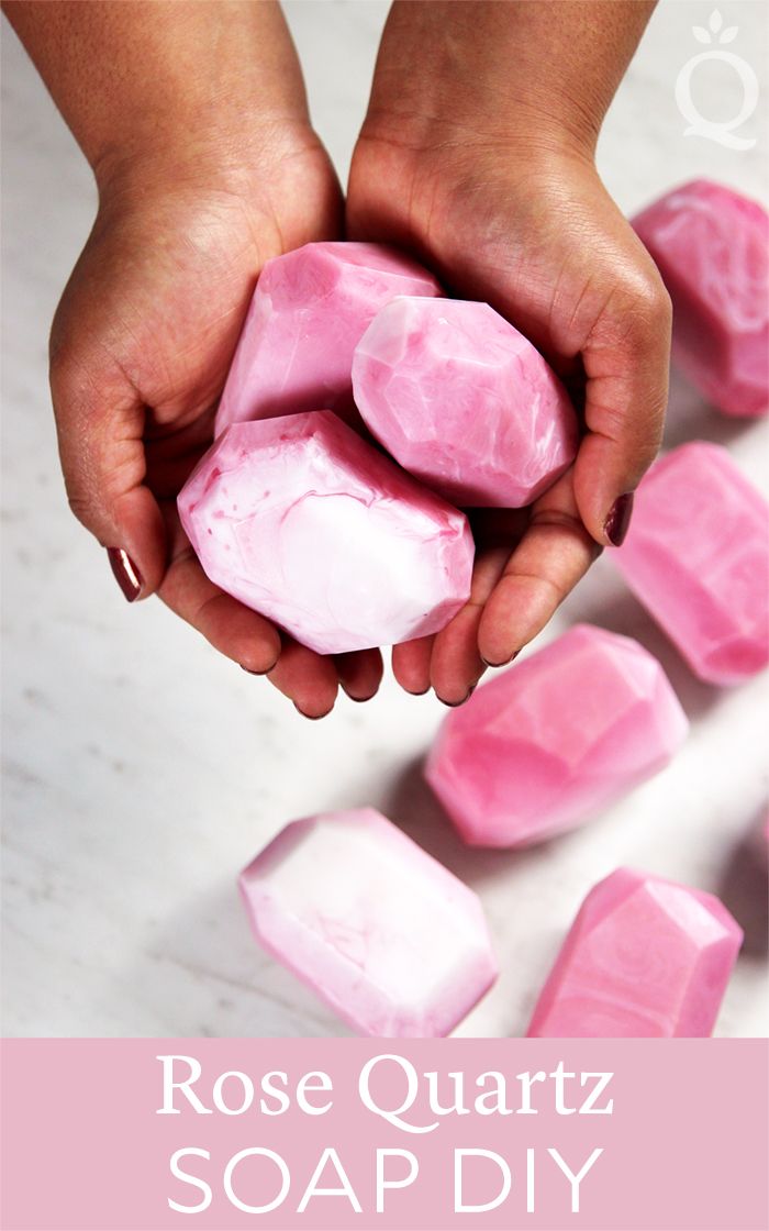 two hands holding soap cubes with the text rose quartz soap diy