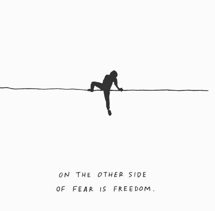 a person on a tightrope with the caption on the other side of fear is freedom