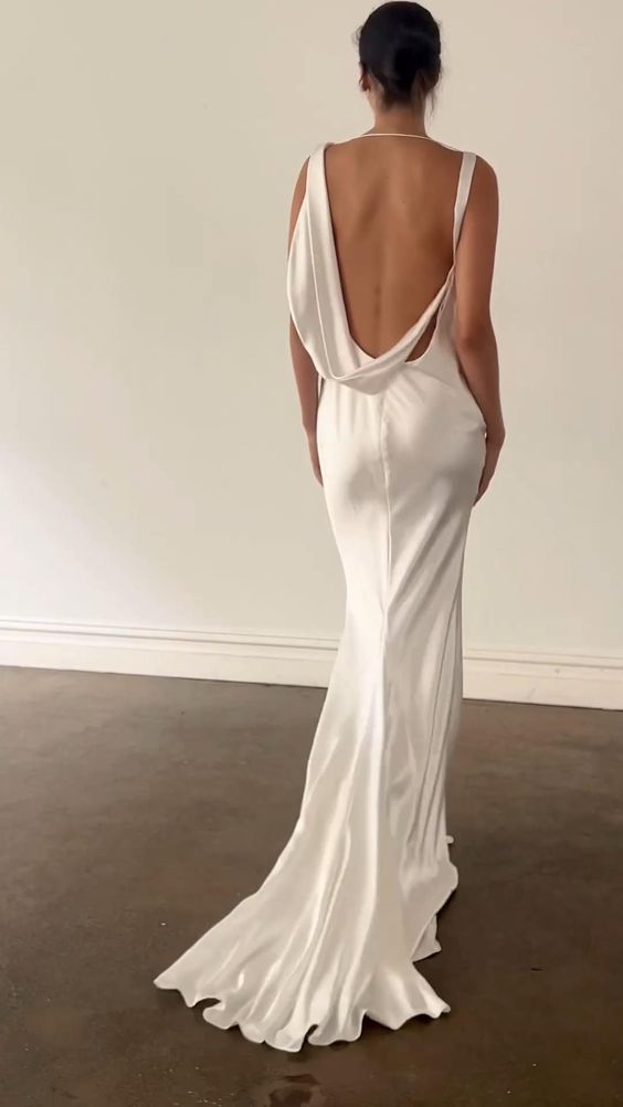 the back of a woman in a white dress