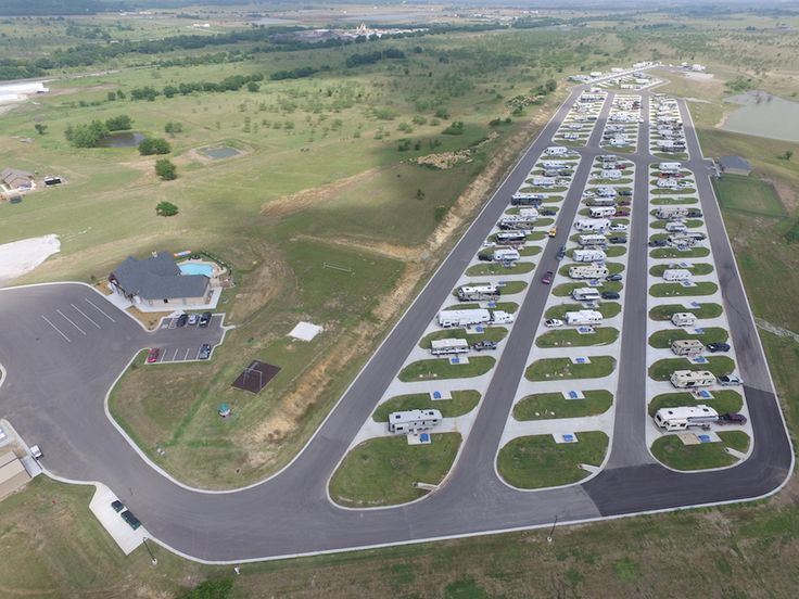 an aerial view of a parking lot with many rv parks