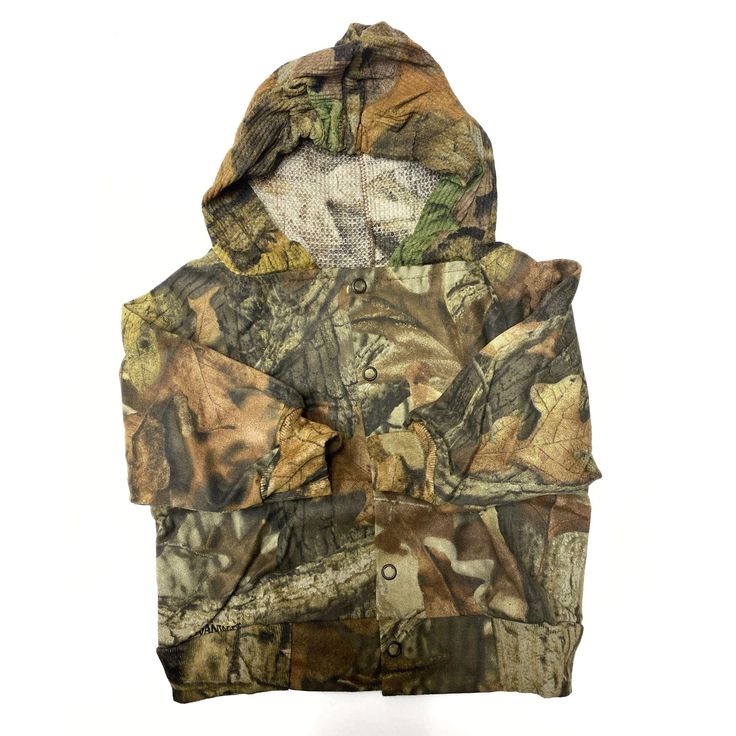 Your little one will be proud to wear the same hunting gear as Dad. This cute camouflage bomber jacket is 100% cotton, complete with a hood and snap button front closure. Size: Small (0-3 months) or Medium (3-6 months) Hooded Khaki Windbreaker For Hunting, Military Style Hooded Windbreaker For Hunting, Outdoor Camouflage Hooded Jacket With Adjustable Hood, Camouflage Hooded Jacket With Adjustable Hood For Outdoor, Winter Camouflage Windbreaker For Hunting, Camouflage Long Sleeve Utility Jacket For Hunting, Camouflage Windbreaker For Winter Hunting, Camouflage Hooded Hunting Outerwear, Camouflage Hooded Outerwear With Adjustable Hood