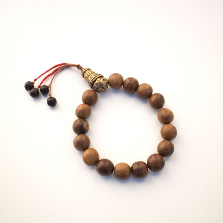 Approximately 12mm round wood beads and vintage Tibetan brass beads wrist mala Fits wrist sizes 7 to 8 Spiritual Wooden Beads Stretch Bracelet For Healing, Spiritual Wooden Beaded Bracelets, Adjustable Wood Bracelets For Meditation, Brown Wooden Bracelet With 8mm Beads, Spiritual Stretch Bracelet With Wooden Beads For Meditation, Spiritual Wooden Beads Stretch Bracelet For Meditation, Adjustable Wooden Bracelet With 8mm Beads, Adjustable Wooden Beaded Bracelets With 8mm Beads, Adjustable Wooden Beaded Bracelet With 8mm Beads