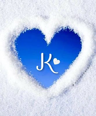 a blue heart with the word i love written in it's center surrounded by snow