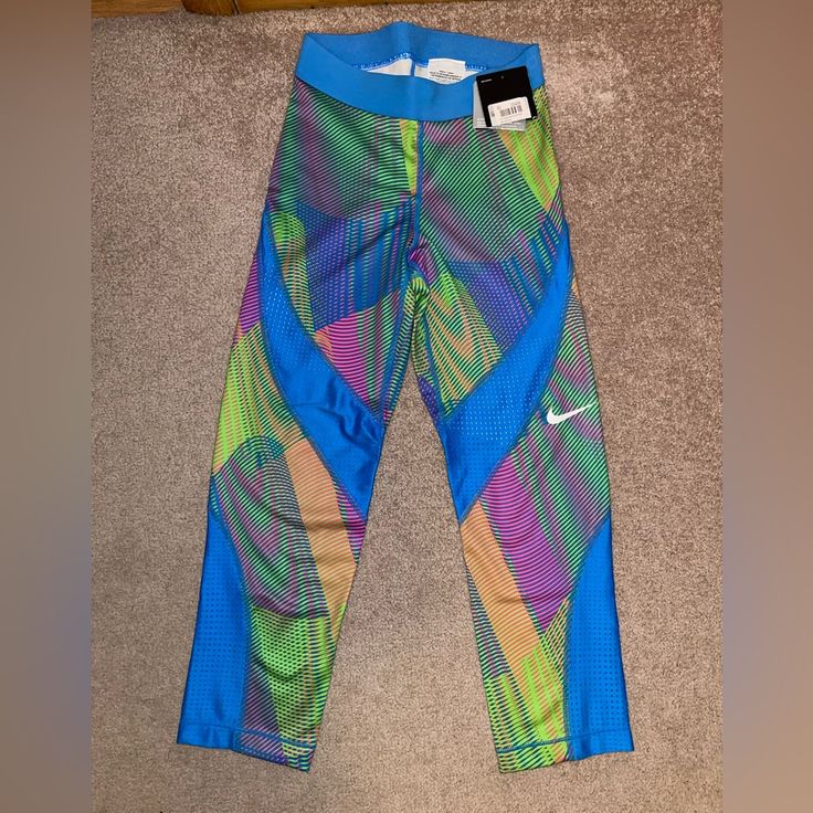 Womens Xs Brand New With Partial Tag Spring Blue Athletic Pants, Spring Nike Fitted Activewear, Nike Fitted Spring Activewear, Nike Fitted Activewear For Spring, Fitted Nike Activewear For Spring, Sports Fitted Multicolor Leggings, Fitted Multicolor Sports Leggings, Sporty Multicolor Pants For Spring, Fitted Multicolor Leggings For Sports