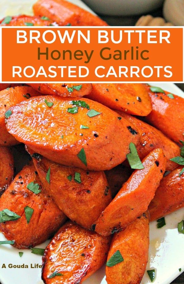 brown butter honey garlic roasted carrots on a white plate with text overlay that reads, brown butter honey garlic roasted carrots