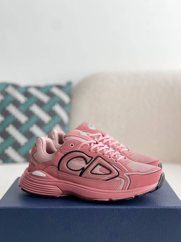 Embrace your bold side with these Dior B30-inspired sneakers in a head-turning pink. This vibrant design, crafted with breathable mesh and technical fabric, is perfect for those who want to make a statement. The sporty silhouette and lightweight construction ensure all-day comfort, while the signature "CD30" logo adds a touch of Dior's iconic style. Whether hitting the gym or the streets, these sneakers will elevate your look with a pop of color and undeniable confidence. Disclaimer: This produc Pink Mesh Sneakers For Running Errands, Dynamic Pink Sneakers For Jogging, Functional Pink Sneakers For Jogging, Dynamic Pink High-top Sneakers, Pink High-top Mesh Running Shoes, Pink Mesh Running Shoes With Rubber Sole, Functional Pink Mesh Sneakers, Dynamic Pink Sneakers With Boost Midsole, Pink Dynamic Sneakers