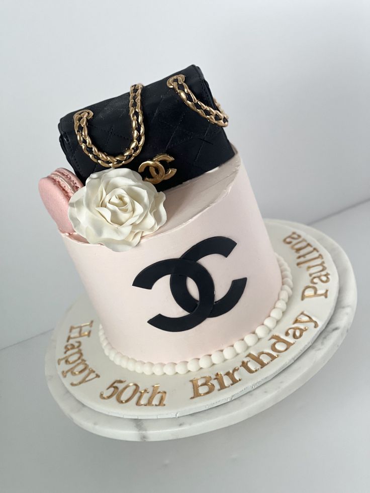 a chanel birthday cake with flowers on top