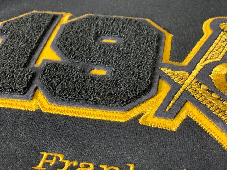 Black and gold sweatshirt Black Varsity T-shirt For Fall, Black Varsity Sweater For College, Black Varsity Crew Neck Sweater, Black Sweater With Letter Embroidery For Winter, Black Crew Neck Sweater For College, Black Letter Embroidery T-shirt For Streetwear, Black Embroidered Logo Sweatshirt For College, Black College Sweatshirt With Embroidered Logo, Black Varsity Hoodie