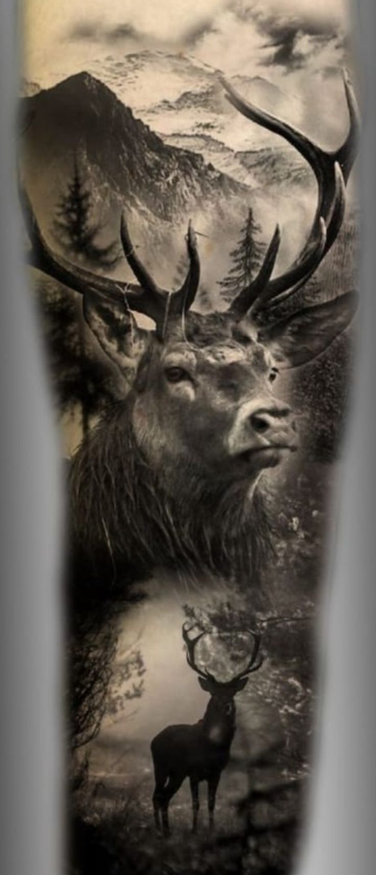 the back of a man's leg with an elk and mountain scene on it