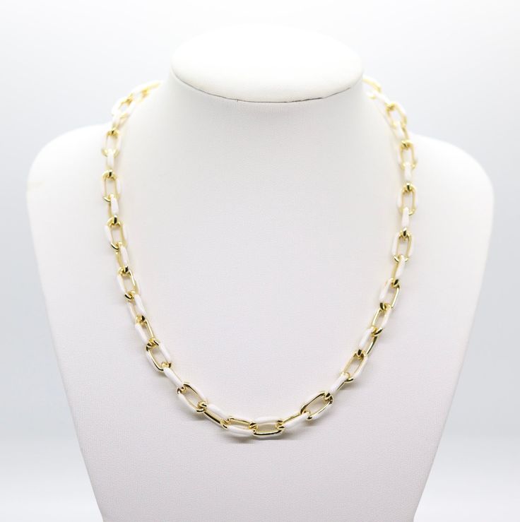 The White and Gold Chain Necklace is a sophisticated piece of jewelry, featuring alternating links of elegant white and shimmering gold. This combination creates a timeless and versatile accessory, suitable for both casual and formal attire. Elegant White Link Jewelry, Chic White Chain Necklace For Formal Occasions, Chic White Chain Necklace For Formal Events, Classic White Link Chain Necklace, Formal White Chain Necklace With Adjustable Chain, Elegant White Chain Necklace With Adjustable Chain, Elegant White Adjustable Chain Necklace, Classic White Necklace With Adjustable Chain, White Necklaces With Gold Chain For Formal Occasions