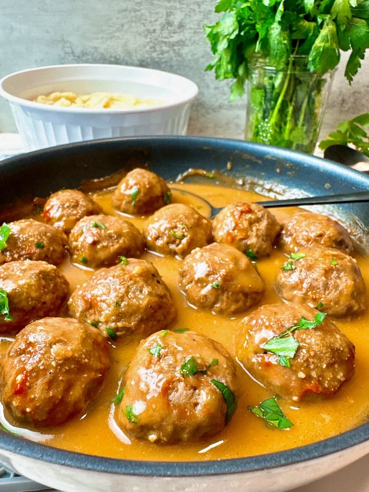 meatballs and gravy in a skillet ready to be eaten