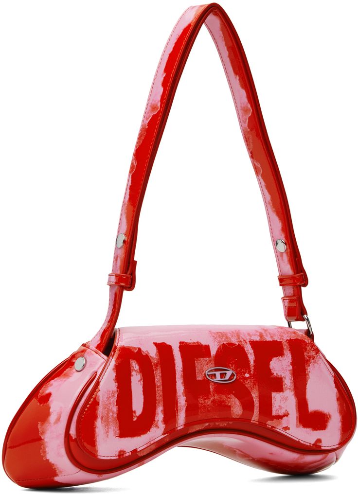 Structured patent faux-leather shoulder bag in red and pink. · Graphic printed throughout · Adjustable crossbody strap · Logo hardware at face · Logo printed at magnetic foldover flap · Logo-woven canvas lining · H7.5 x W13 x D3 Supplier color: Red Pink Diesel Bag, Red Diesel Bag, Red Leather Trim Shoulder Bag, Modern Red Shoulder Bag With Metal Hardware, Red Leather Shoulder Bag With Metal Hardware, Leather Bag Design, Face Logo, Bag Design, Crossbody Strap