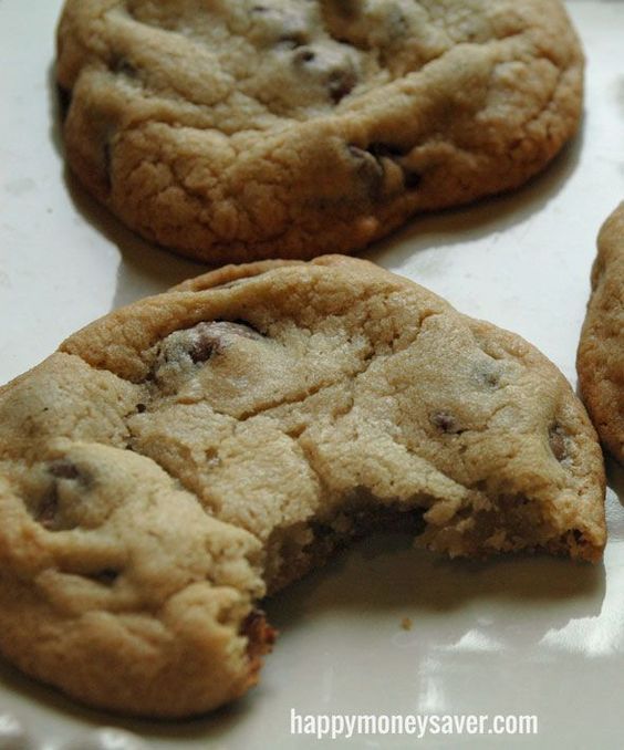 three chocolate chip cookies on a white plate