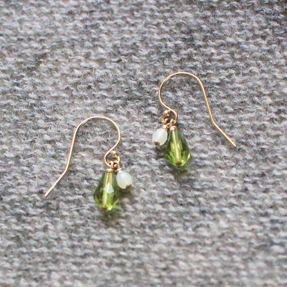 A lovely green teardrop and a little honeydew-colored bead are suspended from each 14k French gold-filled earwire on these sweet little earrings. Handmade in Seattle, WA.+ measures just over .75" from the top curve of the earwire to the base of the teardrop+ made with gold-filled earwires & glass beads+ packaged in a lovely small gift box tied with black ribbonLove purple jewelry? Shop more here: http://etsy.me/2thTQ4DLooking for more earrings? See more here: http://etsy.me/2thQnDc Green Pear-shaped Teardrop Earrings, Green Teardrop Dangle Earrings For Everyday Wear, Green Teardrop Drop Earrings Nickel Free, Green Nickel-free Teardrop Drop Earrings, Everyday Green Dangle Teardrop Earrings, Green Nickel-free Teardrop Earrings, Nickel-free 14k Gold Filled Teardrop Earrings, Everyday Green Teardrop Dangle Earrings, Green 14k Gold-filled Dangle Earrings