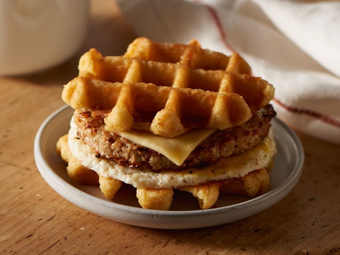 a stack of waffles sitting on top of a white plate