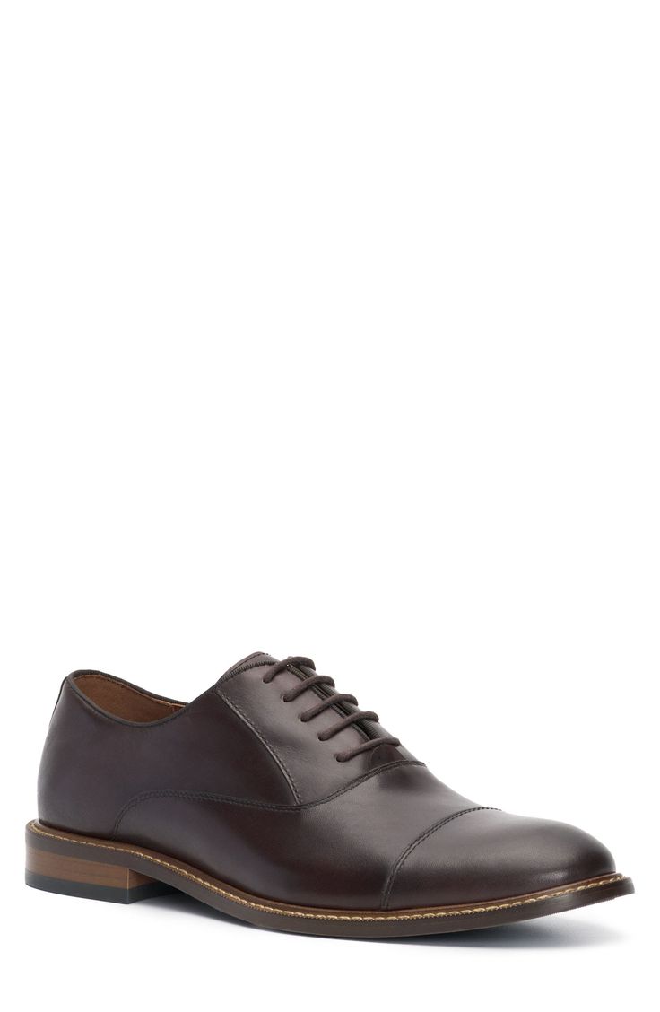 A rich leather upper and cap toe add timeless sophistication to a streamlined oxford that will complement your sleek looks. Lace-up style Leather upper/synthetic and textile lining/rubber sole Imported Brown Cap Toe Oxfords For Derby, Classic Brown Semi-formal Oxfords, Fitted Brown Cap Toe Oxfords, Fitted Cap Toe Derby With Rubber Heel Cap, Fitted Brown Oxfords For Derby, Fitted Derby With Rubber Heel Cap And Cap Toe, Leather Oxford Shoes With Goodyear Welt For Derby, Fitted Leather Oxford Shoes With Goodyear Welt, Brown Dress Shoes With Rubber Heel Cap For Derby