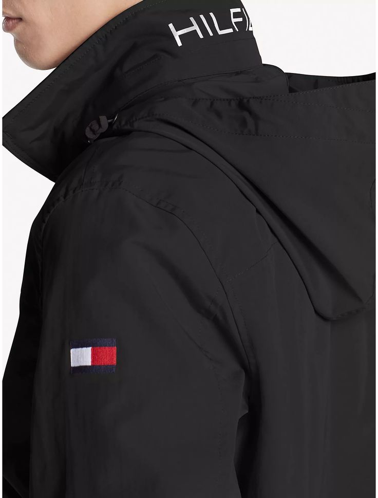 Tommy Hilfiger Men's Regatta Jacket Deep Black 7858429 012 Tommy Hilfiger men's jacket. Our windbreaker features a water resistant shell, a logo collar with a packable hood, and front slash pockets. Regular Fit. 100% nylon. Lightweight, zip closure, side pockets, mesh lining, hood packs into collar. Imported. Machine washable. Tommy Hilfiger Jacket Mens, Tommy Hilfiger Windbreaker, Men's Windbreaker, Tommy Hilfiger Jackets, Deep Black, Tommy Hilfiger Man, A Logo, Black Jacket, Nike Jacket