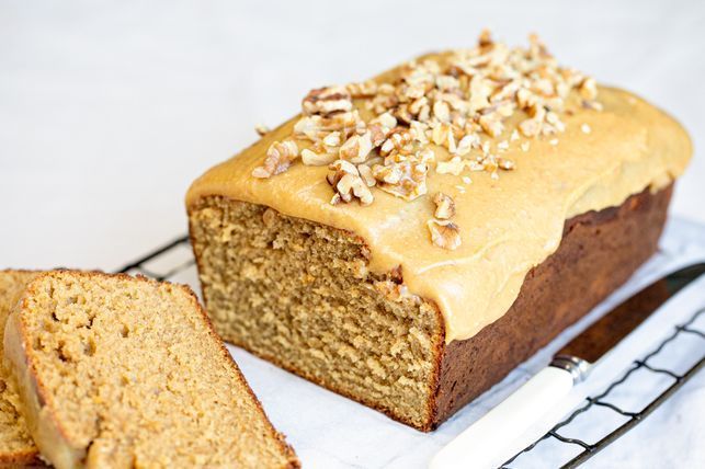 a loaf of banana bread sitting on top of a cooling rack