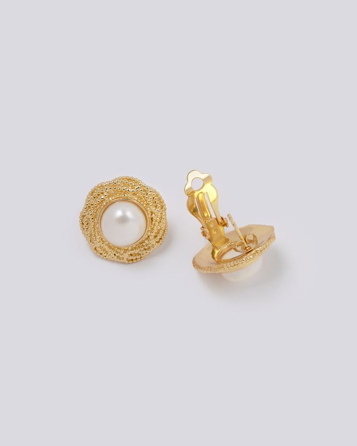 Whether you're sealing deals in the boardroom or gracing a sophisticated soirée, these earrings will complement your outfit with a touch of retro chic. The impeccable craftsmanship ensures durability, while the gold plating adds a touch of luxury that effortlessly elevates your ensemble. With their timeless appeal and versatile design, these statement earrings are a must-have for those who appreciate the fusion of classic style and contemporary elegance. Embrace the power of the 80s while making Chic Gold Plated Clip-on Earrings For Formal Occasions, Formal Metal Clip-on Jewelry, Elegant Metal Clip-on Earrings For Party, Classic Plated Earrings For Anniversary, Chic Evening Clip-on Earrings, Elegant Tarnish Resistant Metal Clip-on Earrings, Classic Gold-tone Round Clip-on Earrings, Chic Gold-tone Hoop Earrings For Formal Occasions, Classic Round Gold-tone Clip-on Earrings