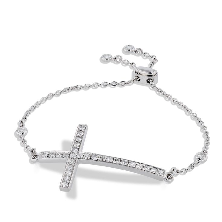 This exquisite Pave Diamond Cross Bracelet is crafted from luxurious 18kt White Gold and illuminating pave diamonds. The milgrain diamond cross and bolo clasp lend an individualistic touch to this exquisite piece from H&H Jewels. Pave Diamond Cross Bracelet 18kt White Gold Pave Diamonds: 1.21ct G/H VS Milgrain Diamond Cross BOLO clasp H&H Jewels SKU: 19070 Luxury Cross Jewelry With Adjustable Chain, Luxury Diamond Tennis Bracelet With Adjustable Chain, Elegant Sterling Silver Cross Rosary Bracelet, Elegant Adjustable Cross Pendant Jewelry, Adjustable Pave Setting Bracelet, Adjustable White Gold Cross Jewelry, White Gold Diamond Tennis Bracelet With Adjustable Chain, Adjustable Pave Setting Diamond Bracelet, Adjustable White Gold Bracelets With Pave Setting